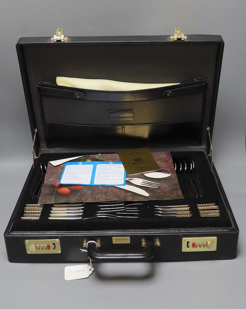 A Solingen parcel gilt cased, cutlery set.